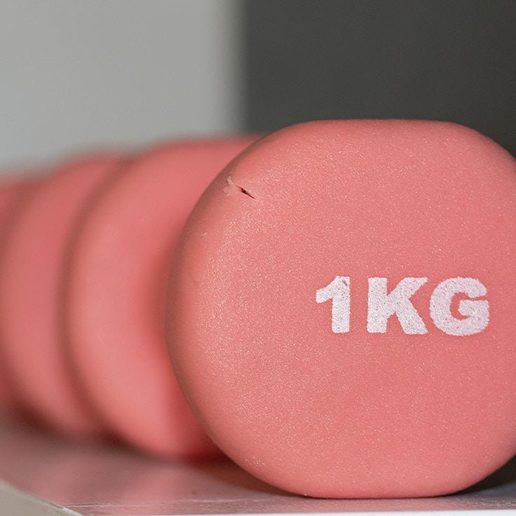 Women in a fitness class doing stretching and mobility exercises